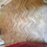 Rustic Oak Blok Flooring – laid in herringbone design with two strip border.